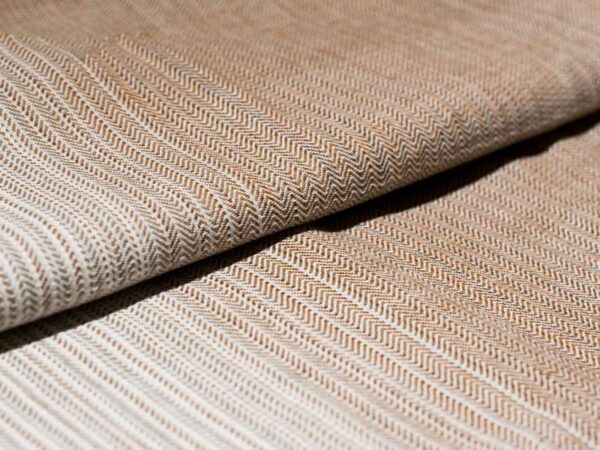 Flat shot of Girasol Earth brown to natural earth tones woven wrap